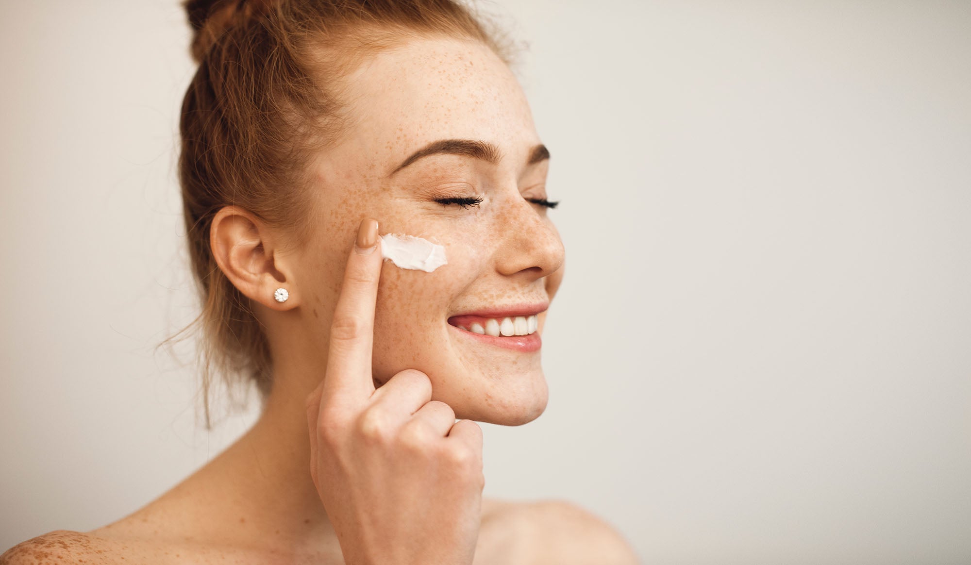woman applying wrinkle face organic skincare or natural skincare or vegan skincare or cruelty-free skincare